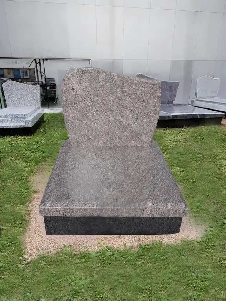 Monument funéraire cinéraire en granit rose aux lignes dépouillées.